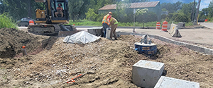 The installation of traffic signal pull boxes at the intersection of Sears Lane and the Parkway.