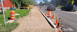 Fine grading along Flynn Avenue in preparation for forming and pouring the new concrete sidewalk along Flynn Avenue.