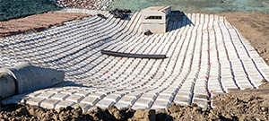 The Champlain Parkway included several stormwater features including the construction of a stormwater detention pond near Englesby Brook. Pictured cable matting.