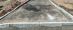 Installation of granite curb along Batchelder Street.