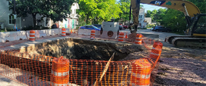 Excavation for the installation of the swirl chamber (new stormwater infrastructure) and the diversion structures in the parking area at the Flynn Avenue Co-op.