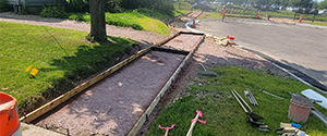 Forming the new concrete sidewalks along the Ferguson Avenue cul-de-sac in preparation for concrete pours.