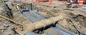 Placement of concrete to encase the electrical and communication duct banks installed along Lakeside Avenue.