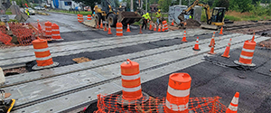 The newly installed asphalt and precast concrete panels at the railroad crossing at Flynn Avenue.