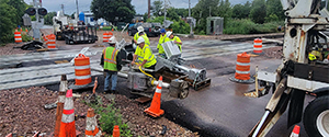 Installation of the new railroad crossing signal and gates at the Flynn Avenue railroad crossing.