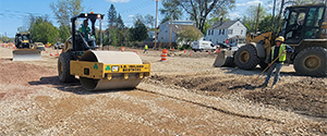 Grading of Briggs Street and the new cul-de-sac at the westerly end of Briggs Street in preparation for base course paving.