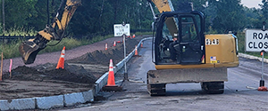 Placing topsoil along the green area between the shared use path and the Parkway between Sears Lane and Flynn Avenue.