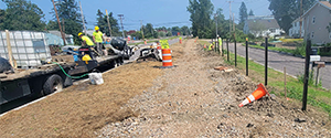 Installation of fence posts for the decorative fencing between the shared use path and Batchelder Street along the Parkway.