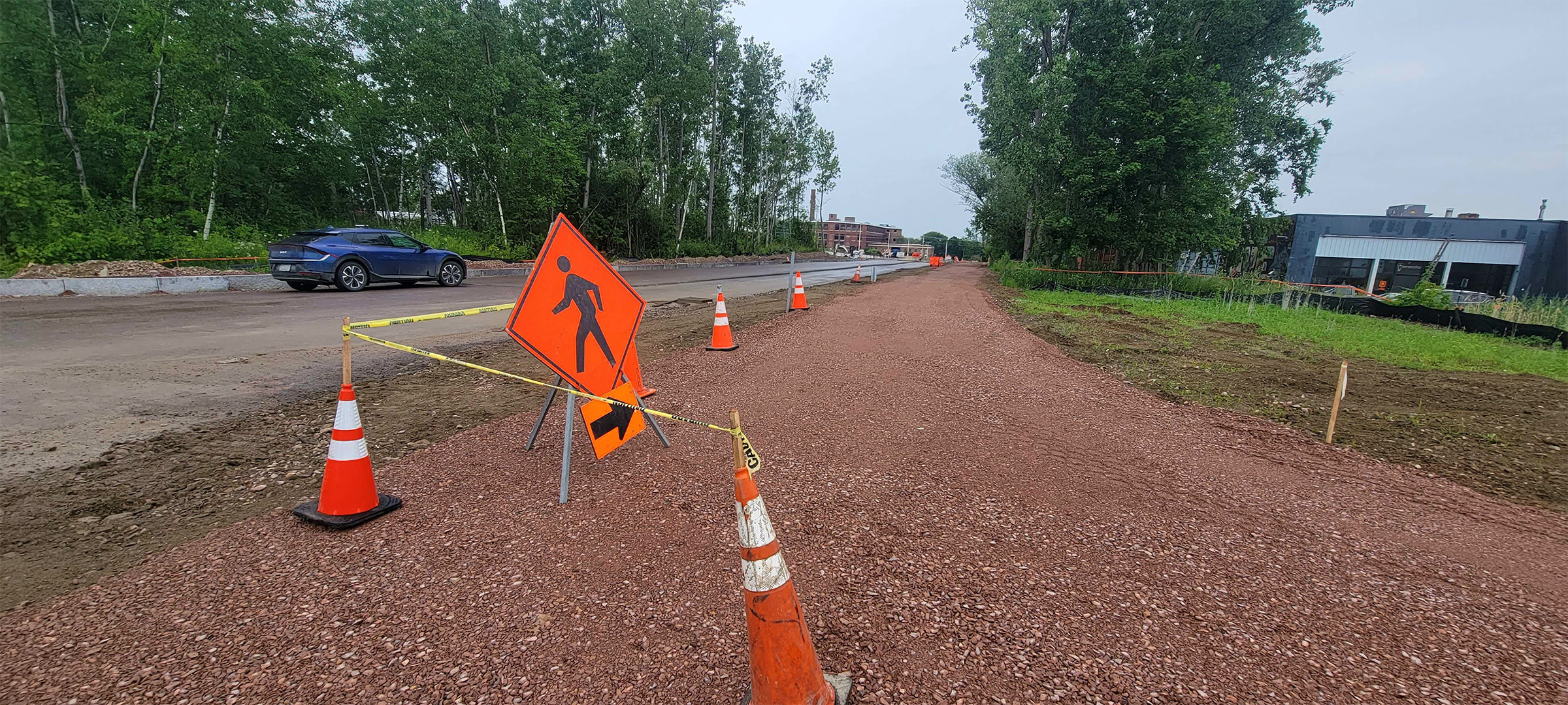 Fine-grading the shared use path and temporary pedestrian detour for the Lakeside Avenue closure.