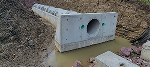 The Champlain Parkway included several stormwater features including the construction of a stormwater detention pond near Englesby Brook. Pictured completed outlet pipe.