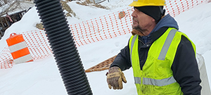 The installation of underdrain, a stormwater feature, beneath the new Champlain Parkway between Lakeside Avenue and Home Avenue. Pictured is a flushing basin.