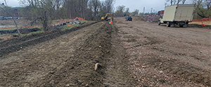 Crews grade the common fill before placing dense grade material on the shared use path along the Parkway between Sears Lane and Flynn Avenue.