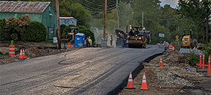 Base paving operations along Sears Lane.