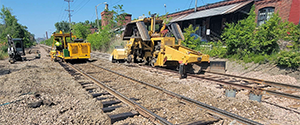Adjusting the surface tracks just north of the Flynn Avenue railroad crossing.